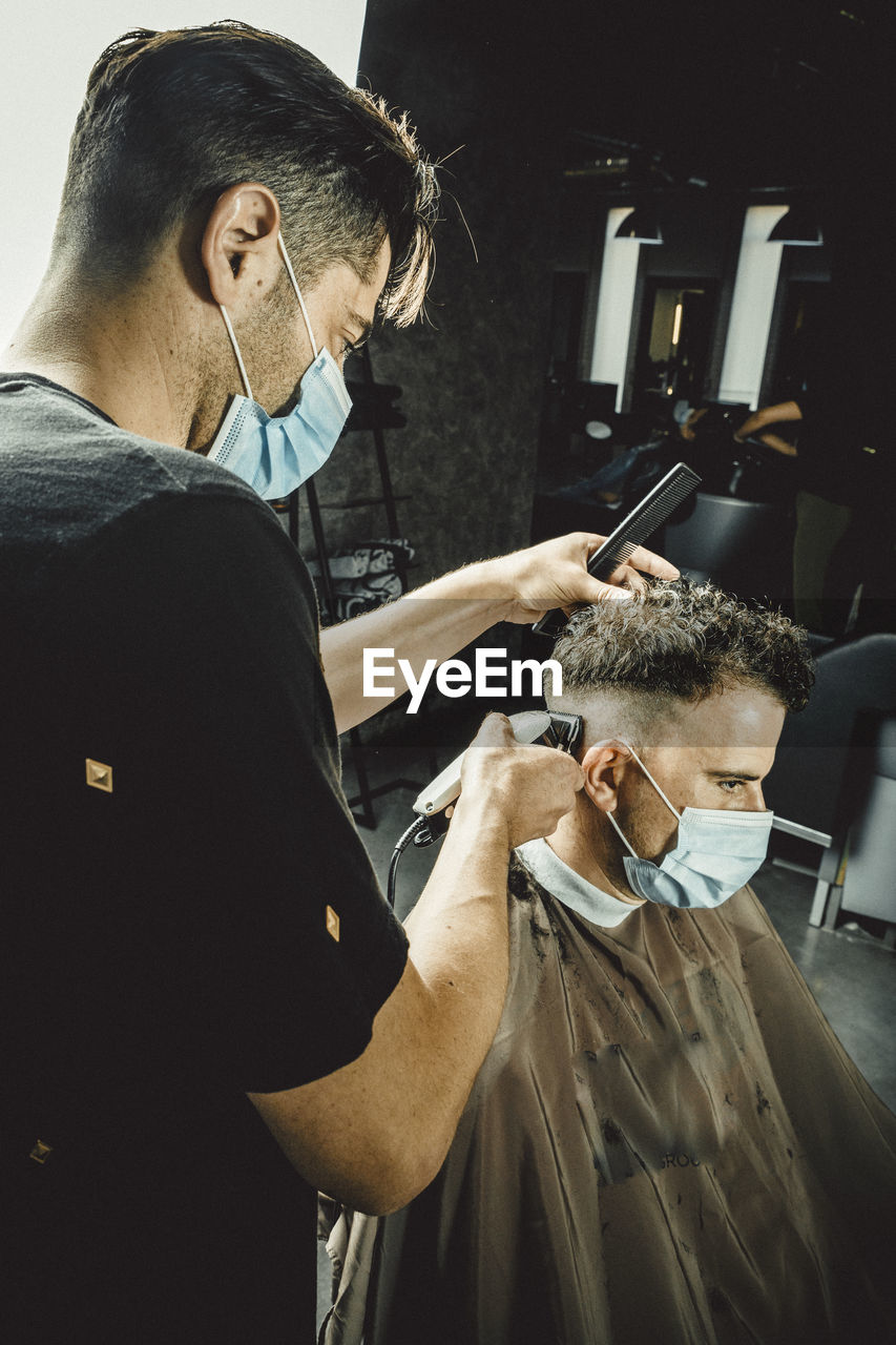 Beautician and hairdresser working with mask for the covid19 virus