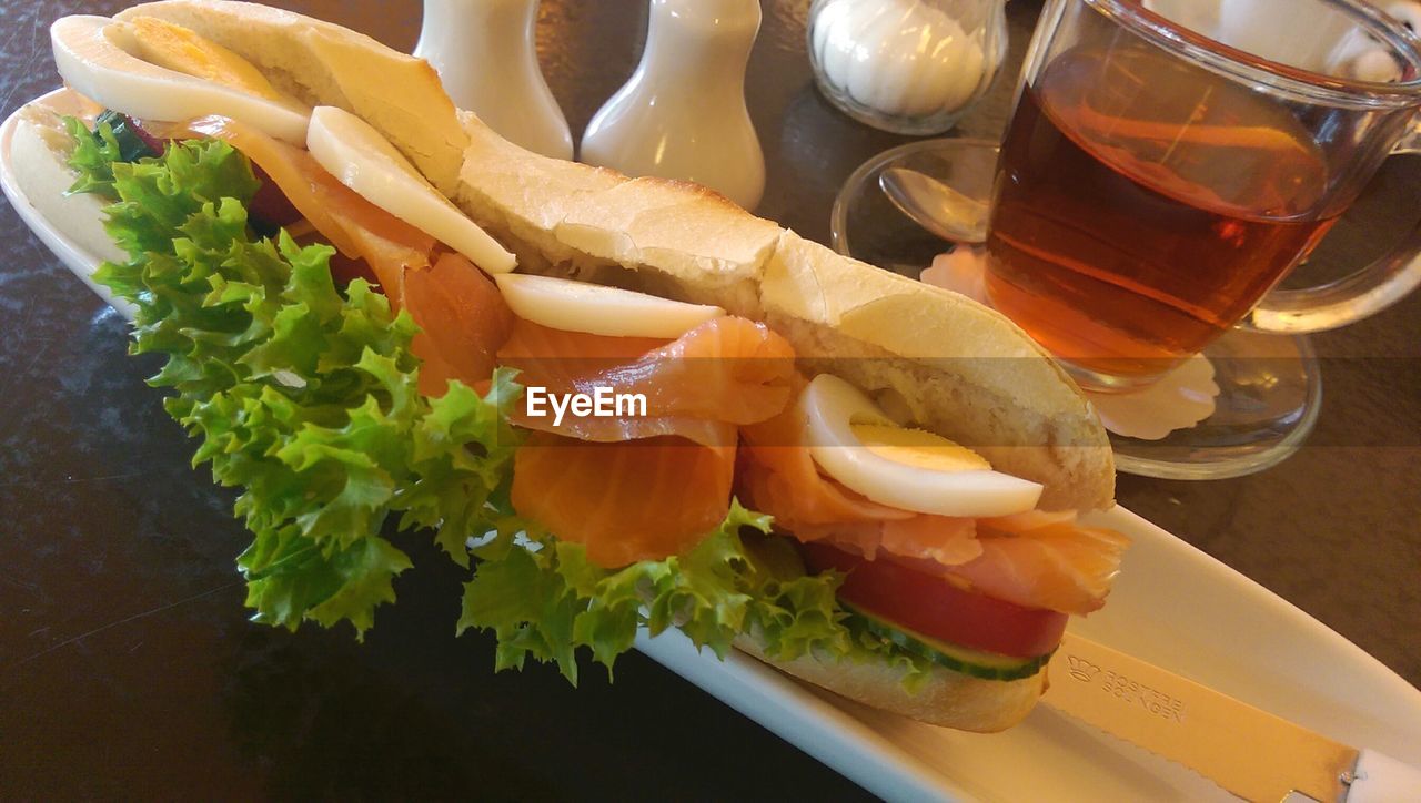 Ham sandwich served on table