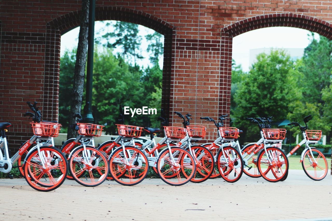 BICYCLE PARKED AGAINST WALL