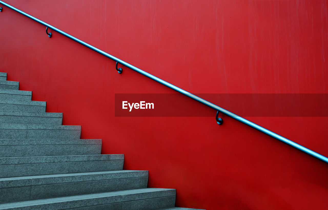 Steps by red wall