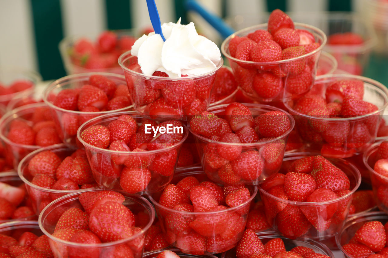 Close-up of fruits in container for sale at market stall