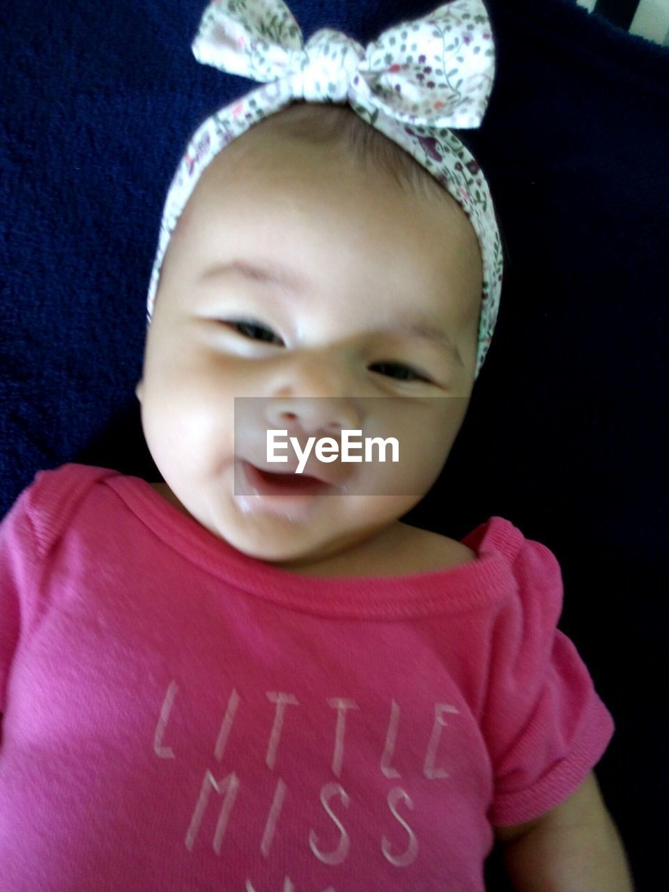 CLOSE-UP PORTRAIT OF SMILING BABY