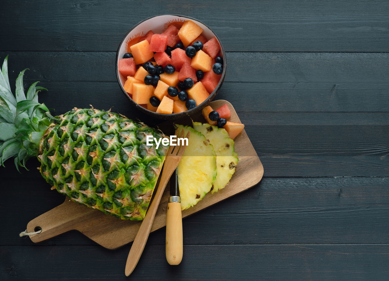 HIGH ANGLE VIEW OF CHOPPED VEGETABLES ON TABLE