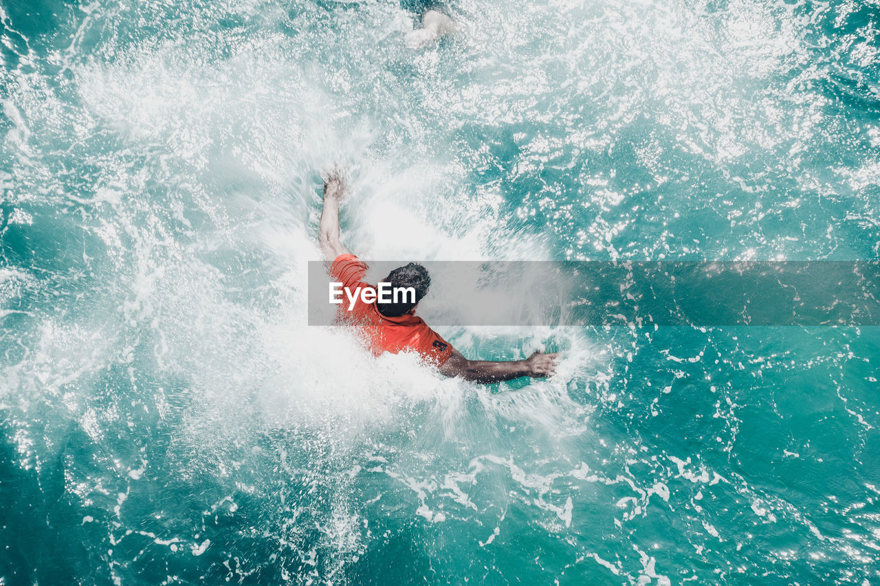 Man swimming in sea