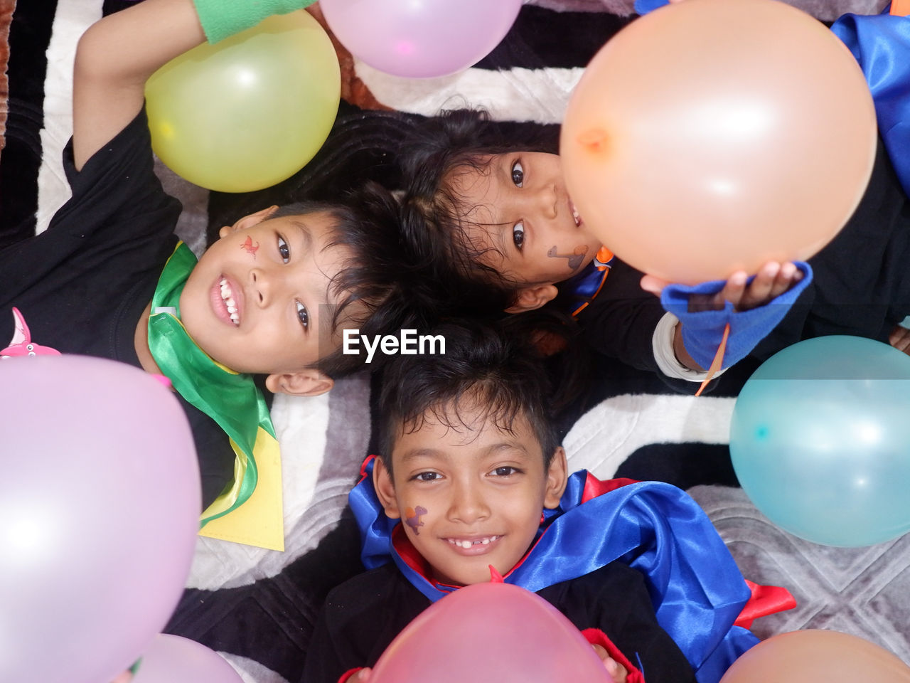 Happy child with colorful balloons. birthday party. creative trends initiative - localized per