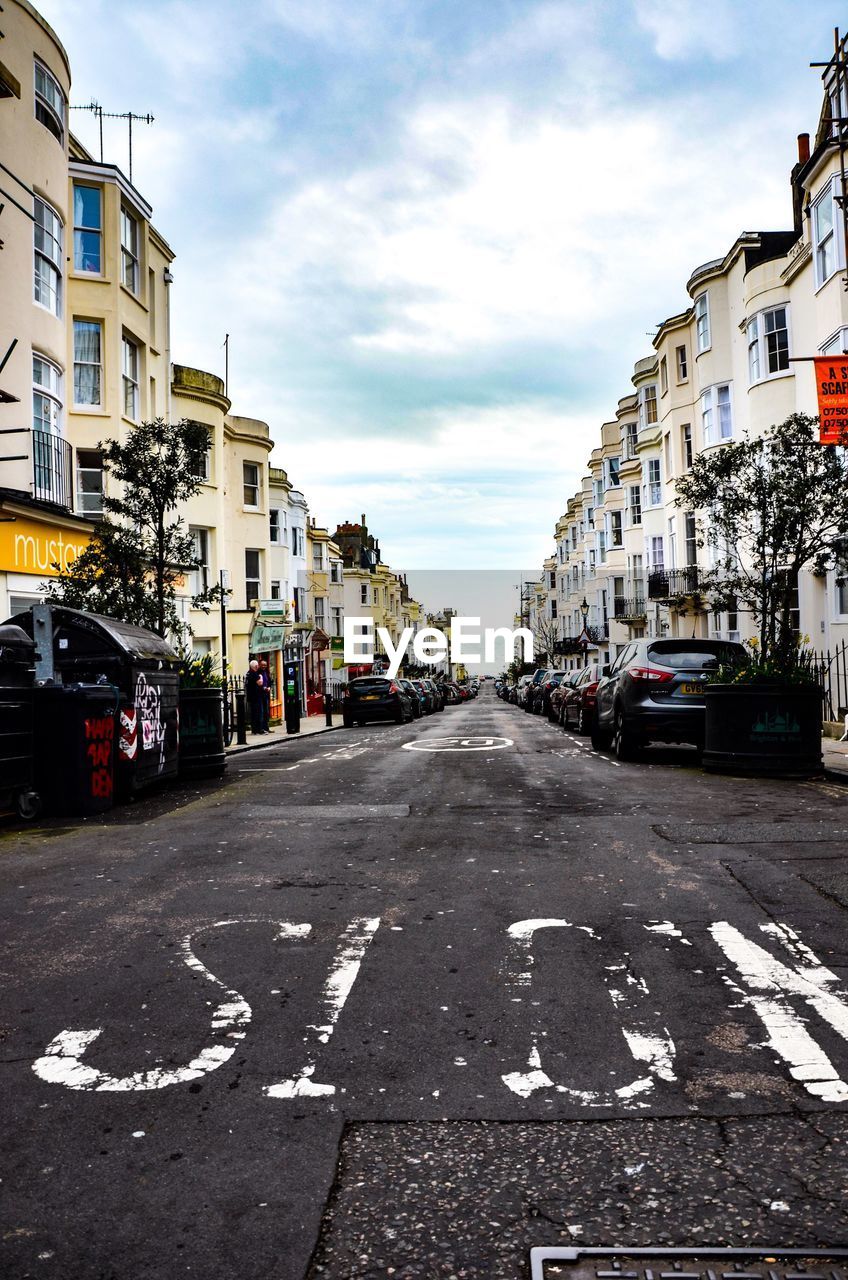 CARS ON ROAD IN CITY