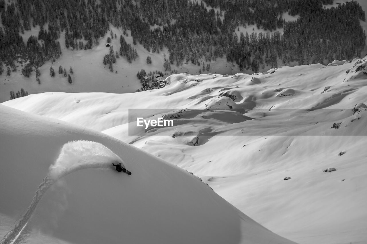 High angle view of a distant person snowboarding