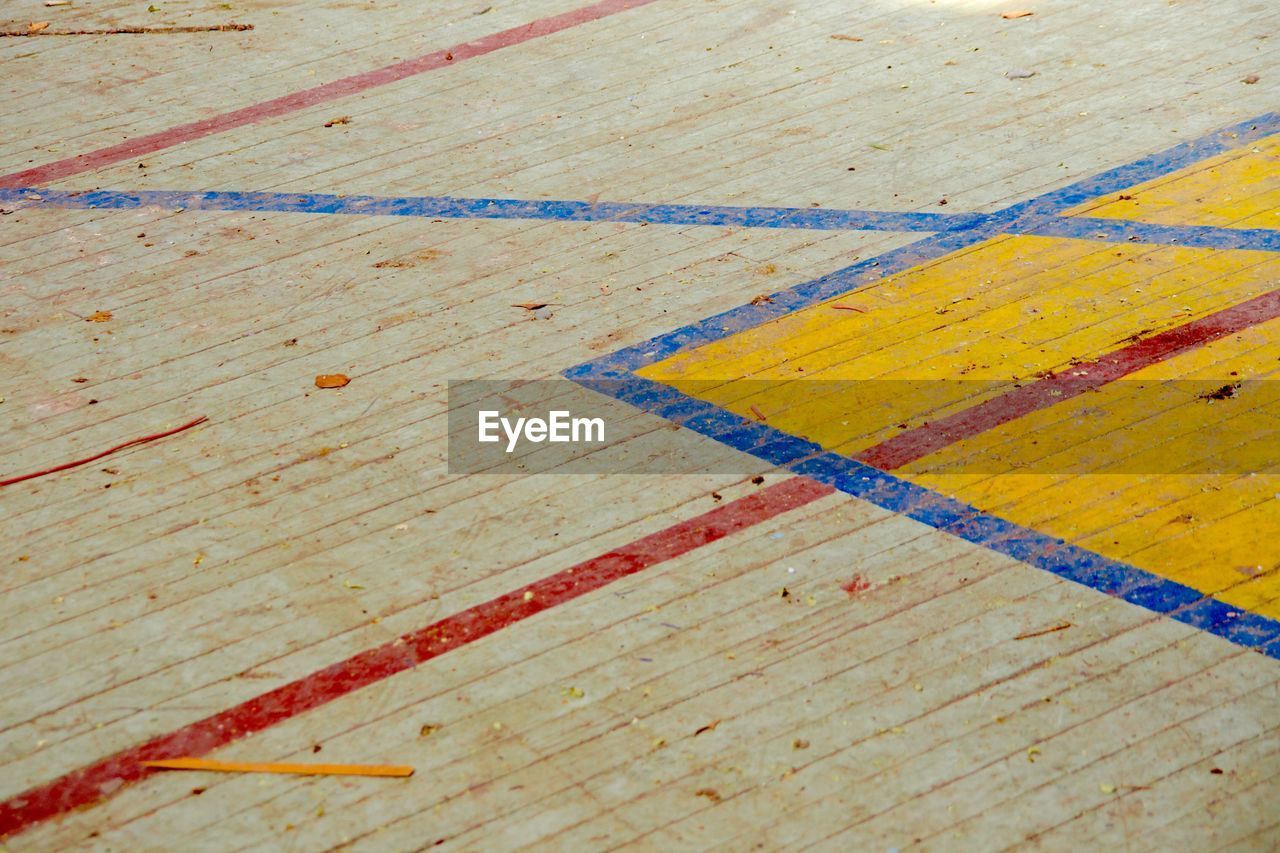 HIGH ANGLE VIEW OF MULTI COLORED WOODEN FLOOR
