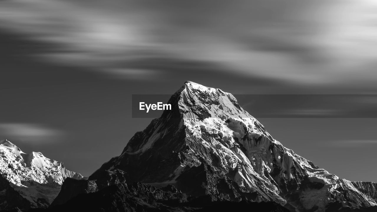 Scenic view of snowcapped mountain against sky