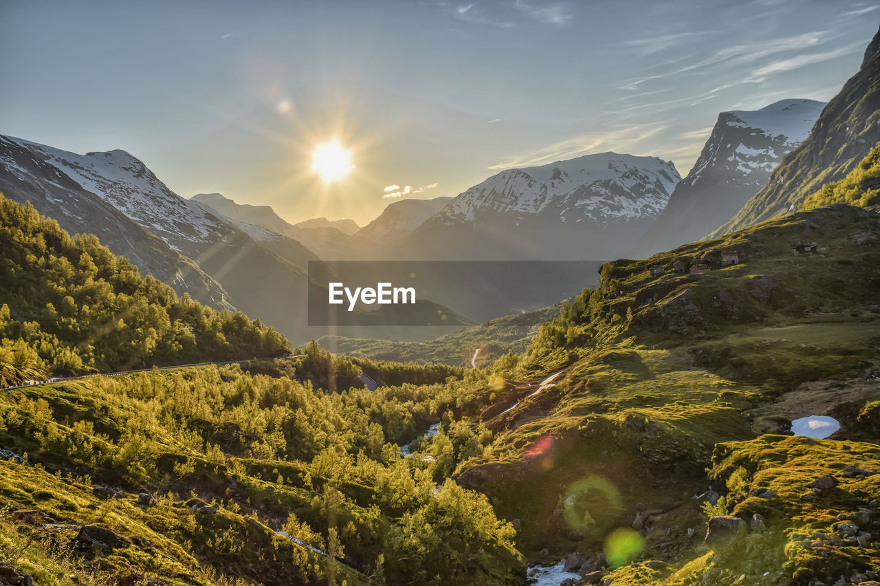 Scenic view of mountains against sky during sunset