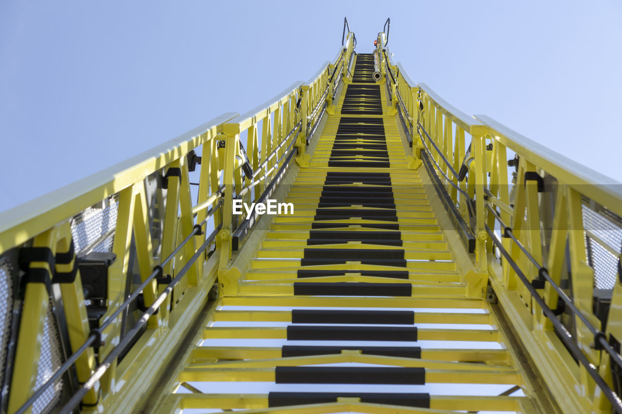 LOW ANGLE VIEW OF FOOTBRIDGE AGAINST SKY