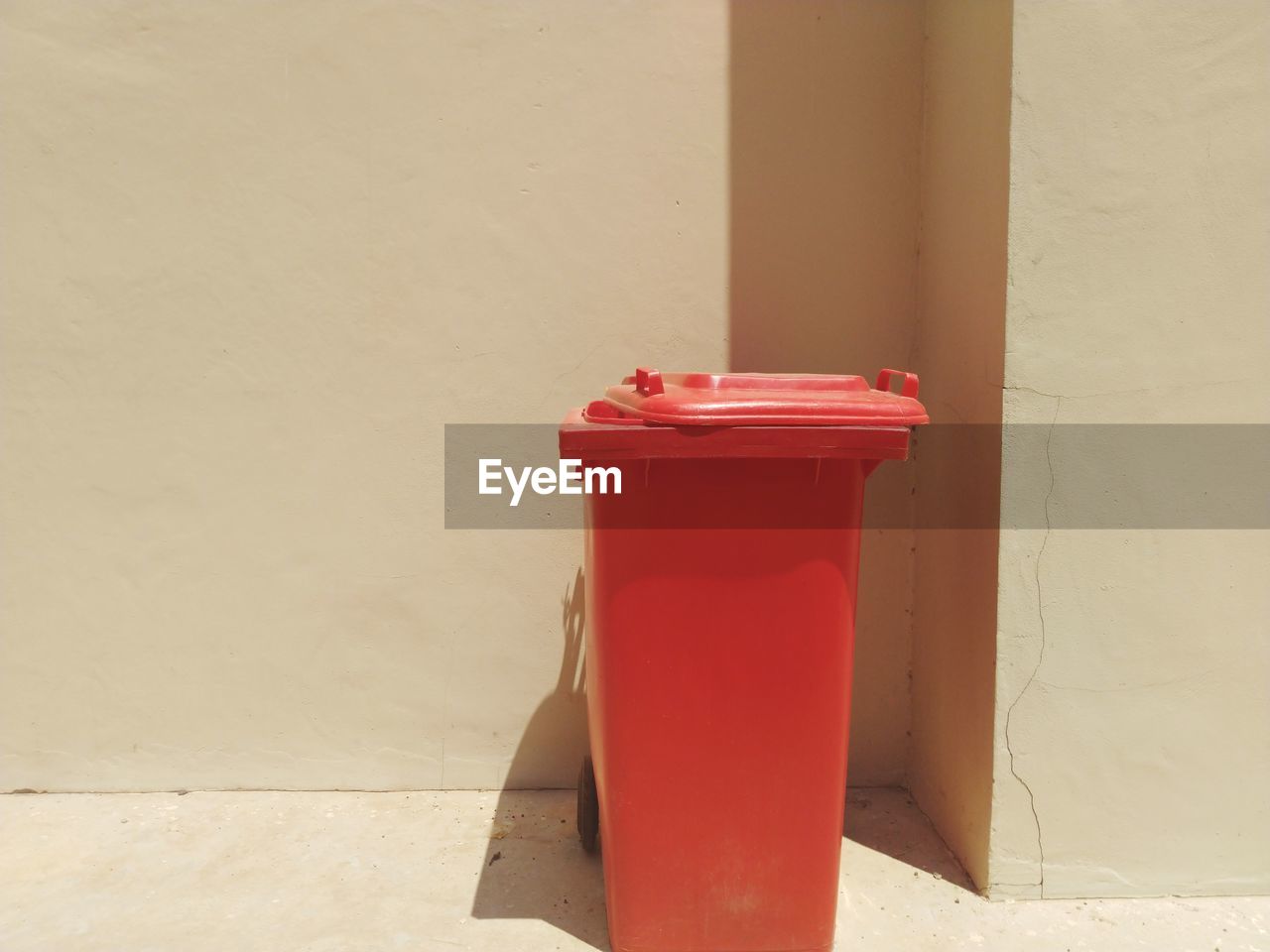 CLOSE-UP OF RED BELL ON TABLE