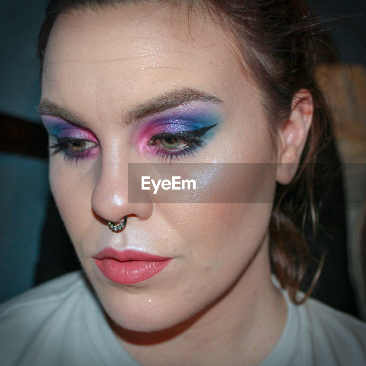 Close-up of thoughtful young woman with make-up