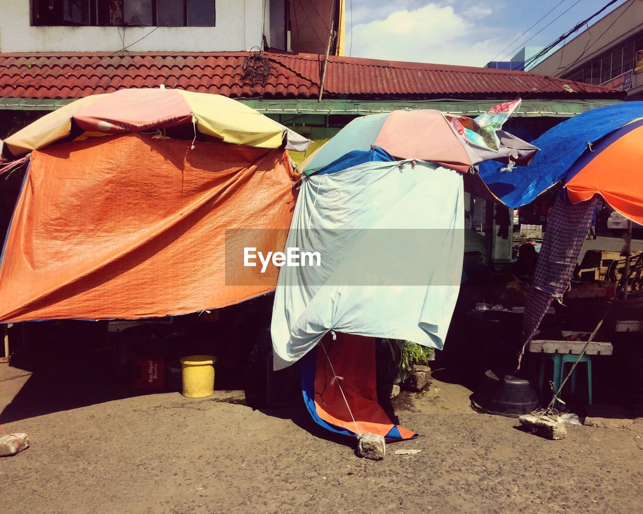 REAR VIEW OF MAN DRYING OUTDOORS