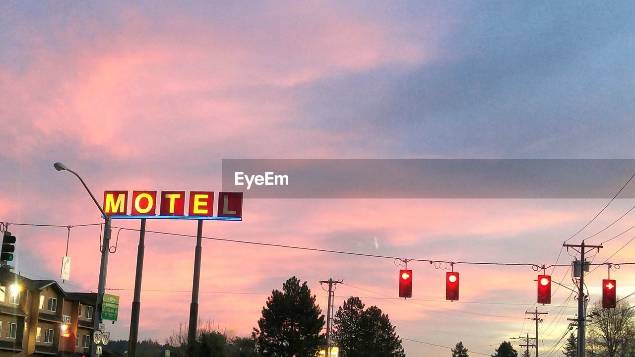 VIEW OF ROAD SIGN AT SUNSET