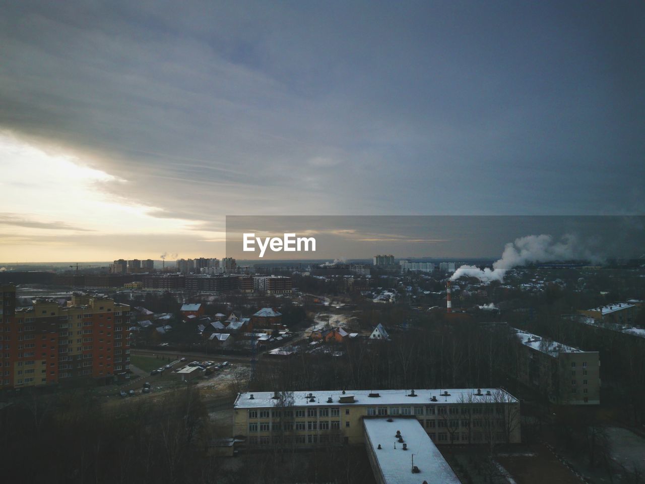 HIGH ANGLE VIEW OF TOWNSCAPE AGAINST SKY DURING SUNSET