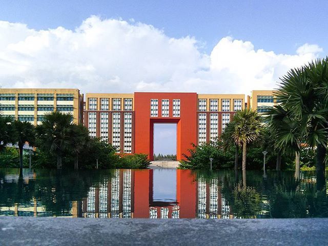 VIEW OF BUILT STRUCTURE AGAINST CLOUDS