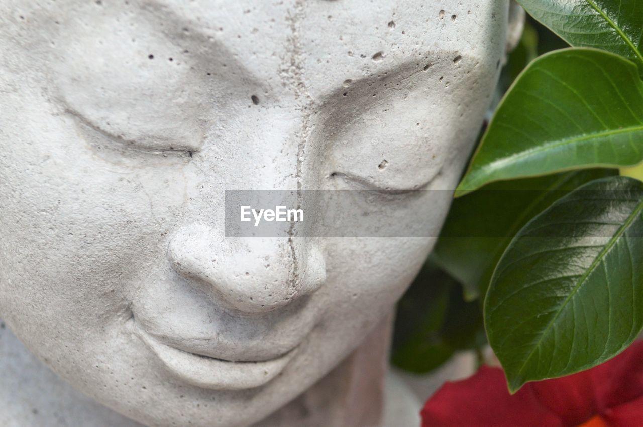 Close-up of smiling buddha statue 