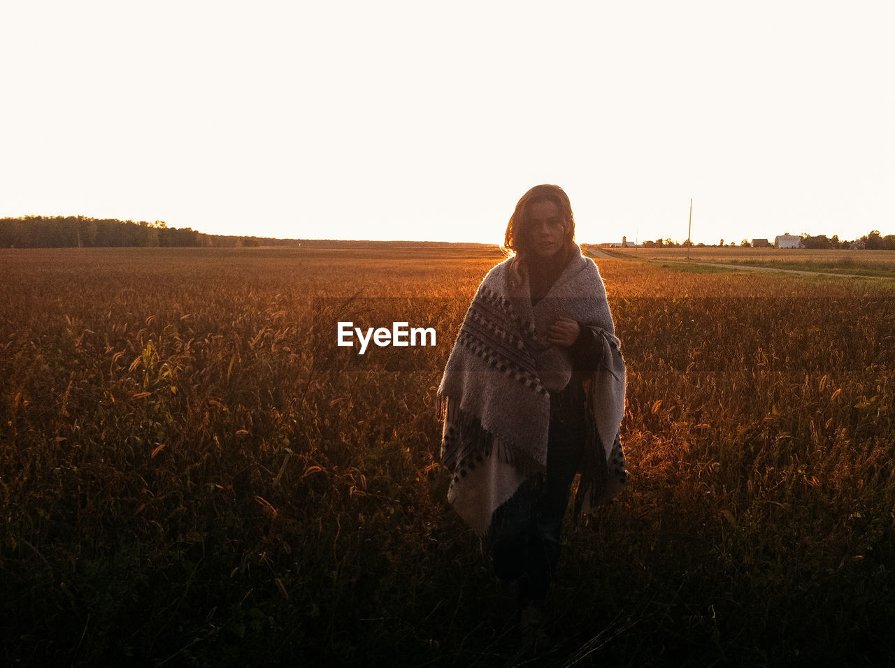 Woman standing on a wheat field