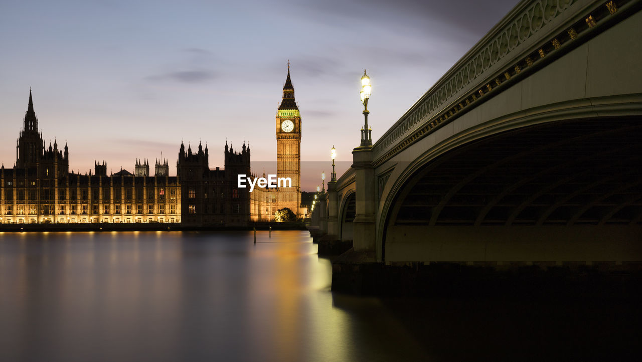 Uk, england, london, panorama of westminster bridge and river thames at dusk with palace of westminster in background