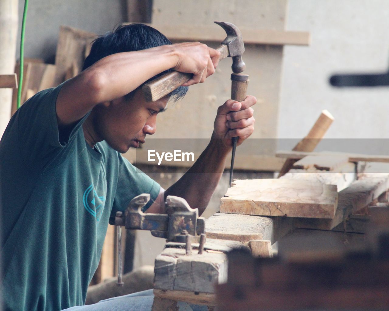 Midsection of man working at workshop