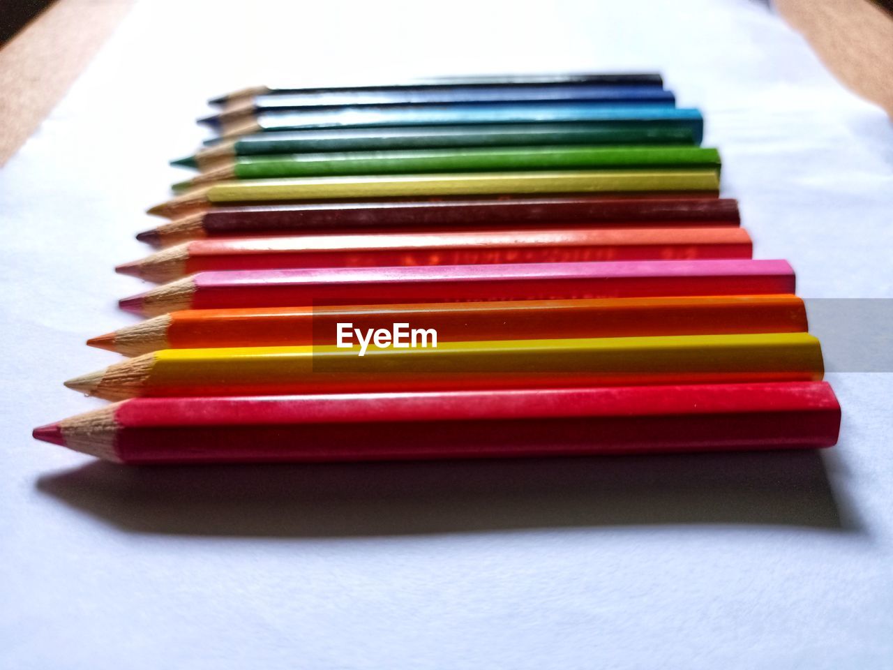 Colored pencils are visible from the right side