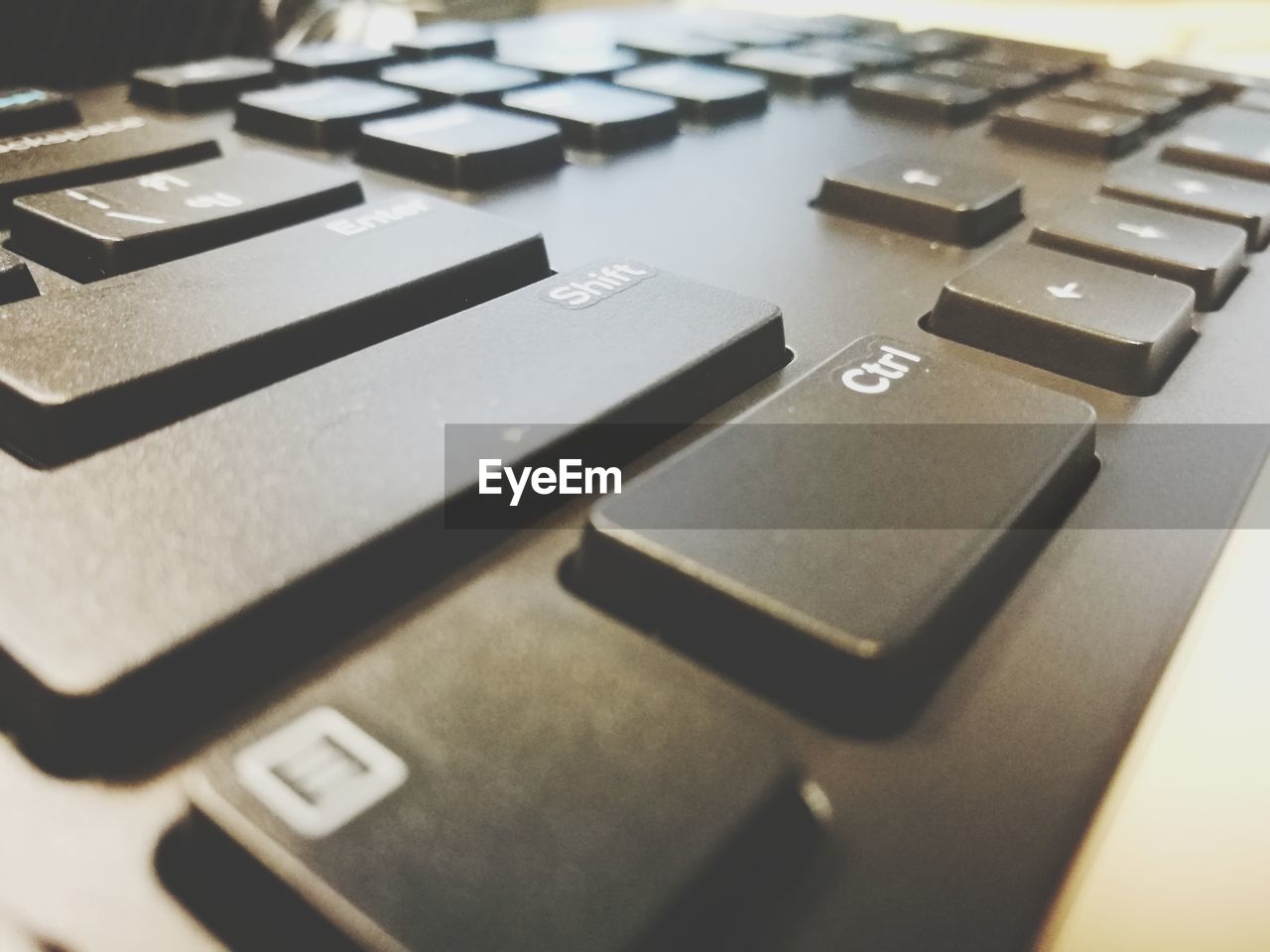 CLOSE-UP OF LAPTOP ON KEYBOARD