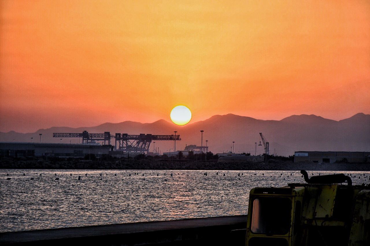 SCENIC VIEW OF SUNSET OVER SEA