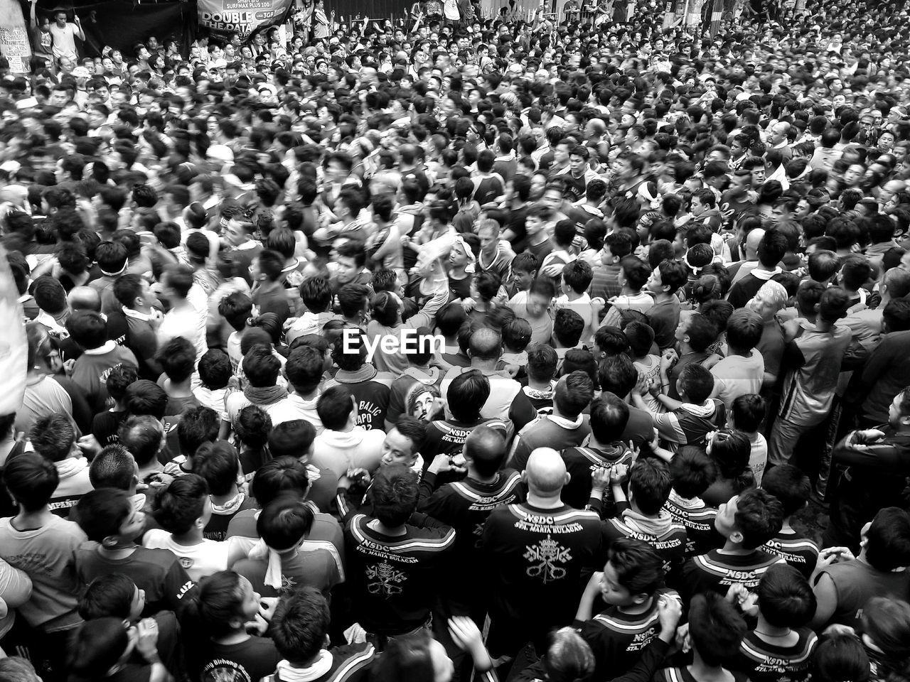 HIGH ANGLE VIEW OF PEOPLE IN STREET