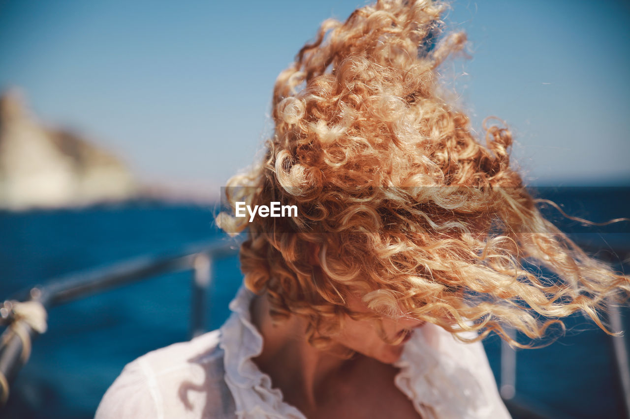 Close-up of woman with tousled hair