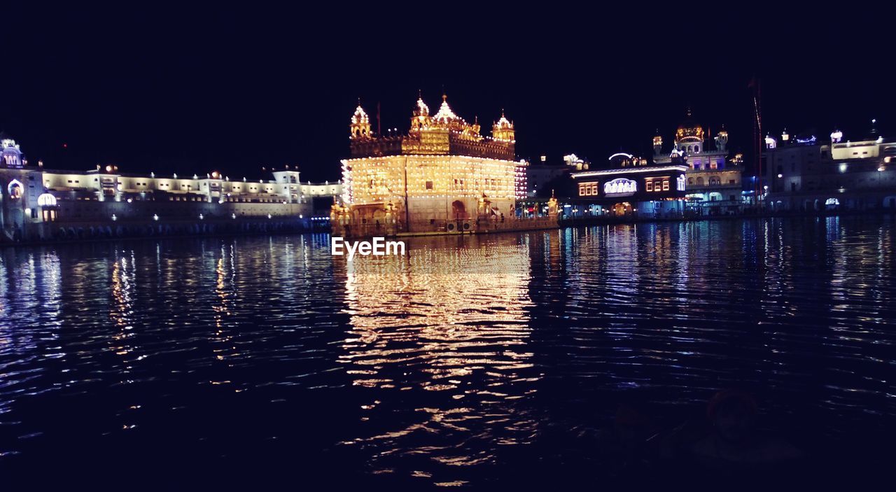 REFLECTION OF BUILDING IN WATER