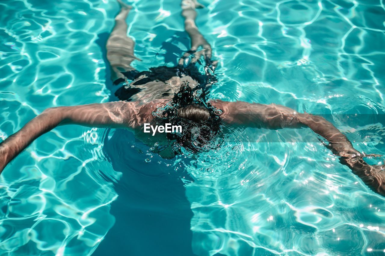 High angle view of man in swimming in pool