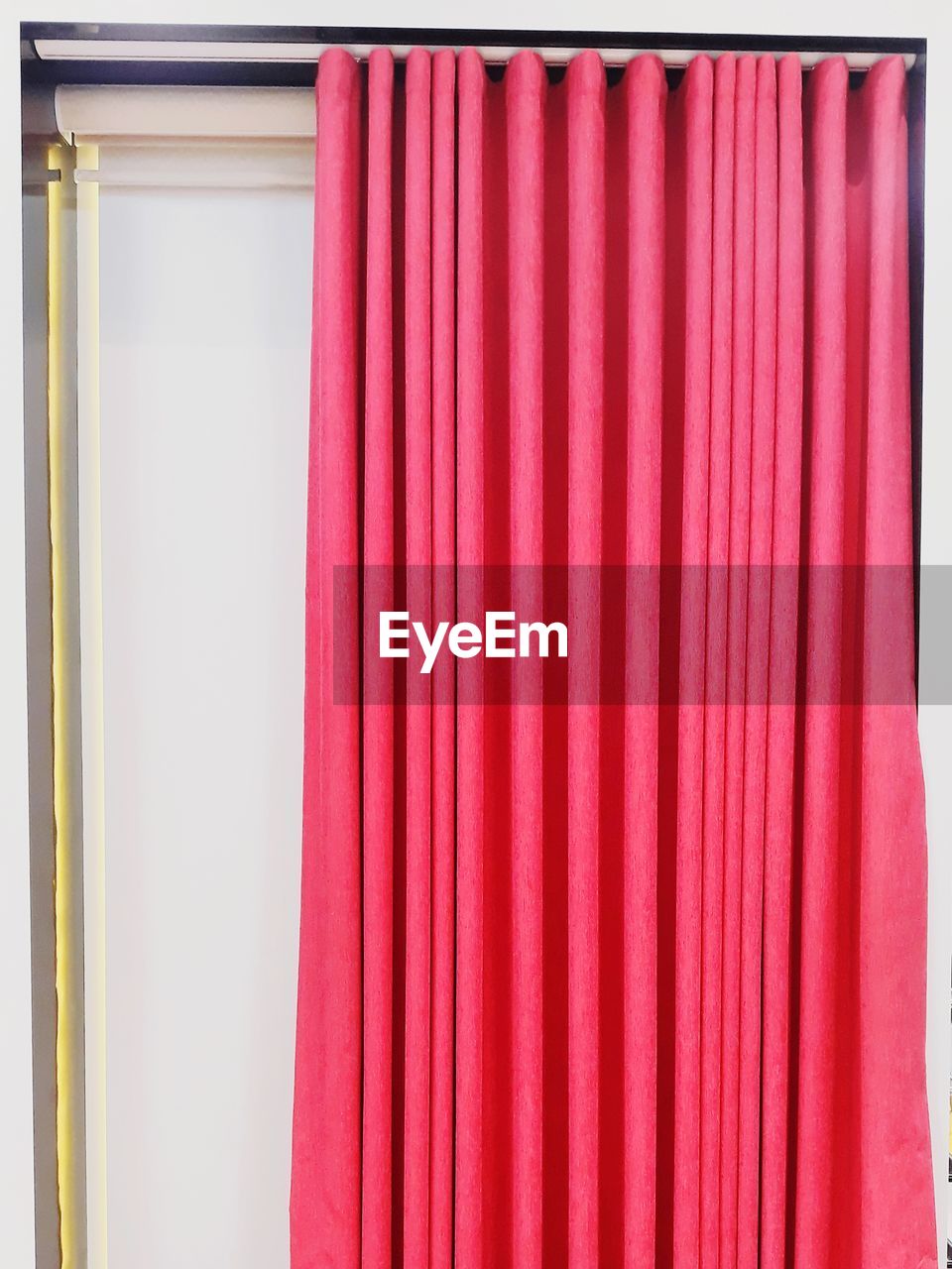 CLOSE-UP OF PINK CURTAIN