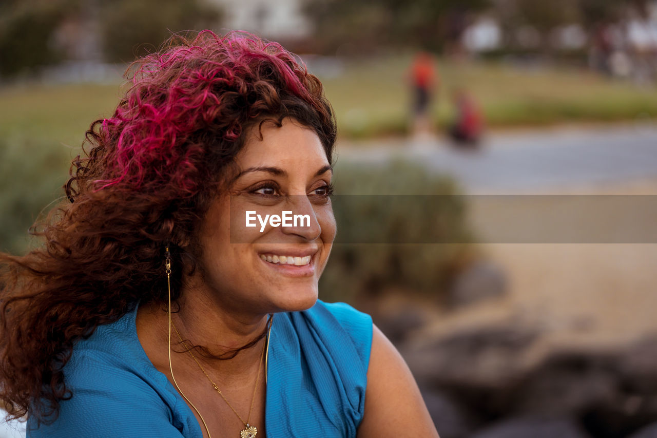 Portrait of smiling woman outdoors