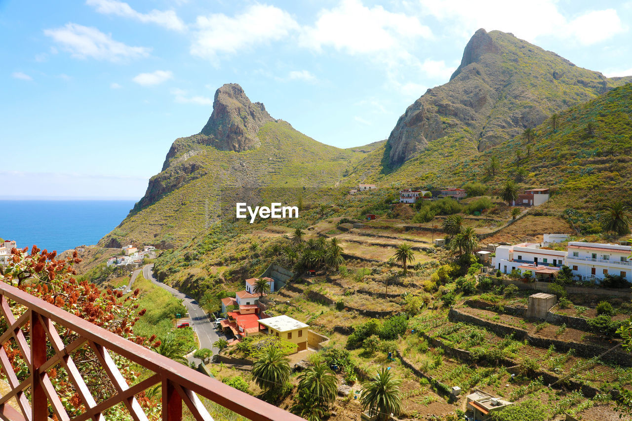 Scenic view of sea and buildings against sky