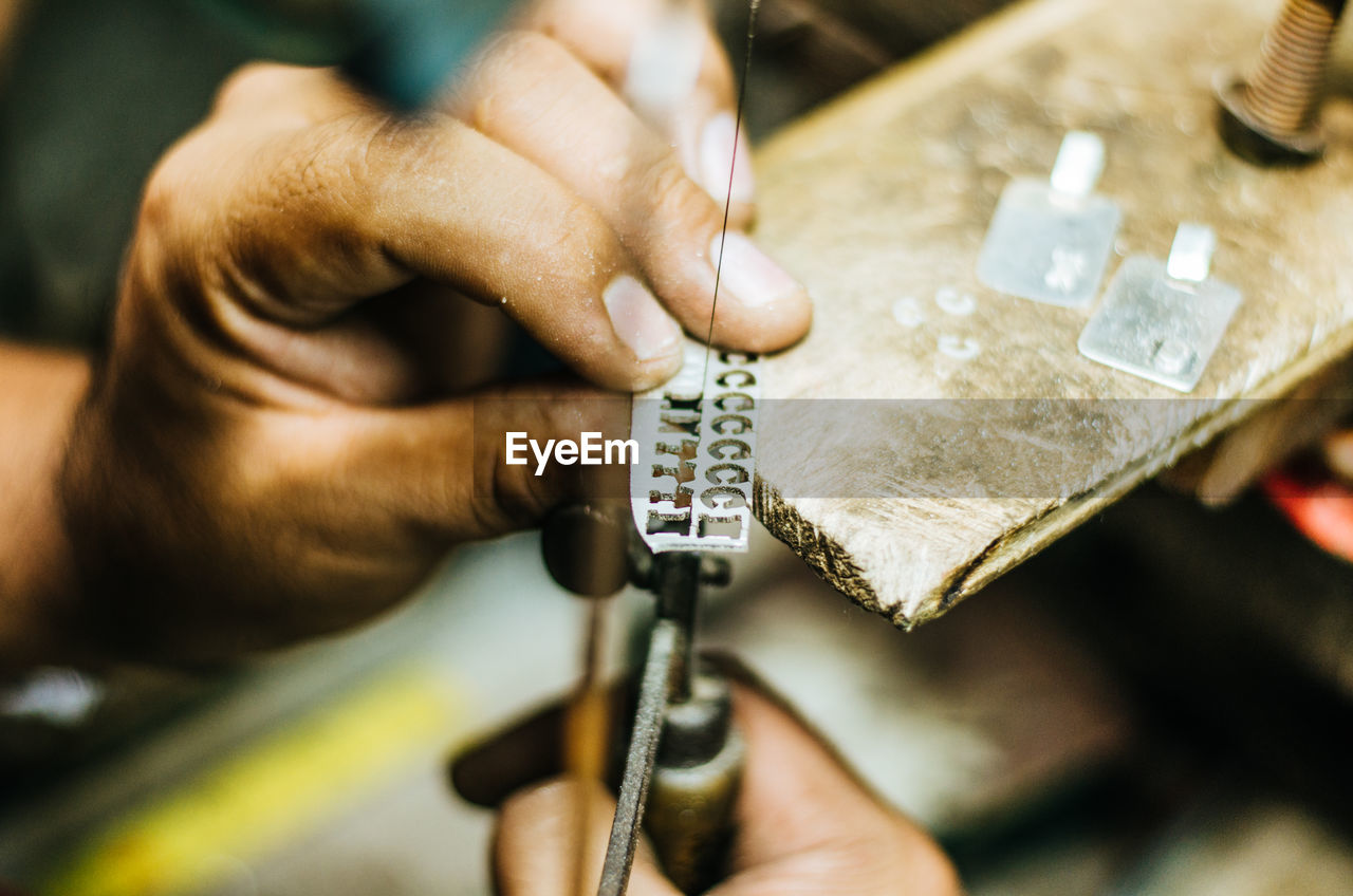 Close-up of jeweller working in workshop