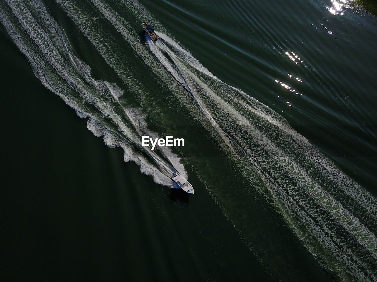 High angle view of boats sailing on river