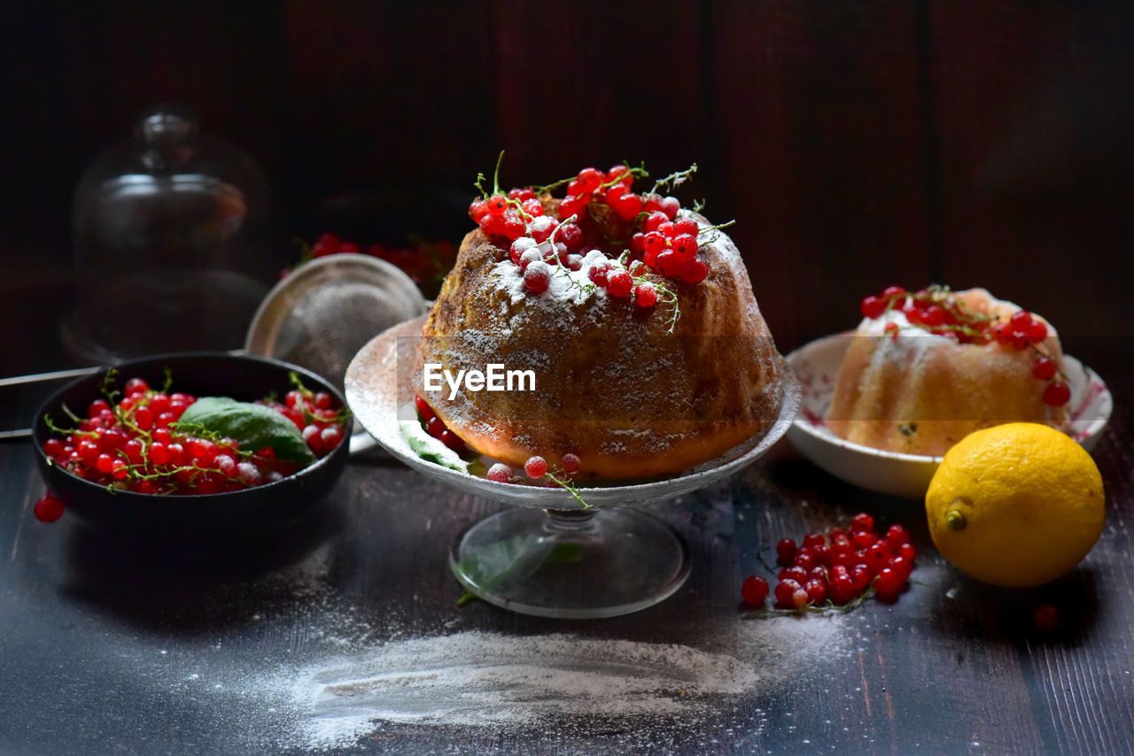 Close-up of dessert with currants in plate on table