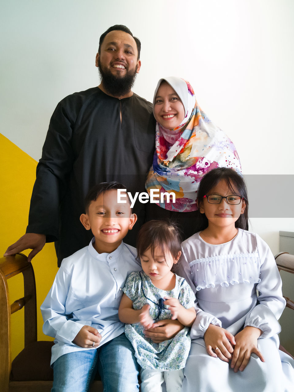 Portrait of happy family at home on eid-ul-fitr