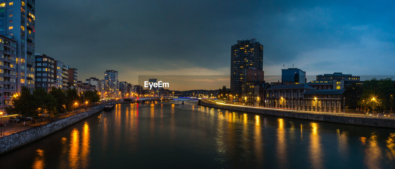 Illuminated city at waterfront