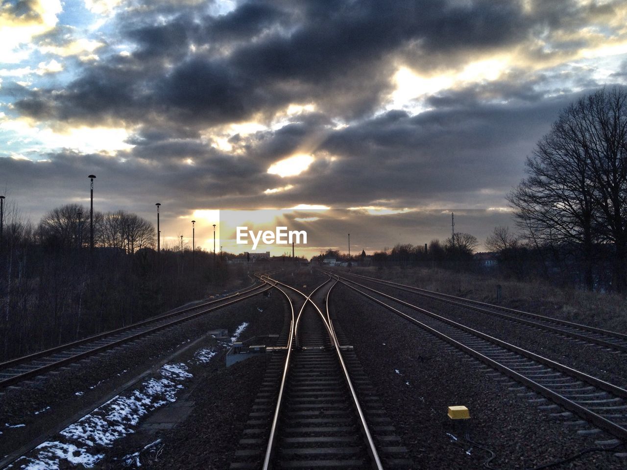 Railroad tracks during sunset