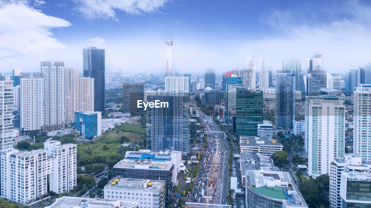 High angle view of buildings in city against sky