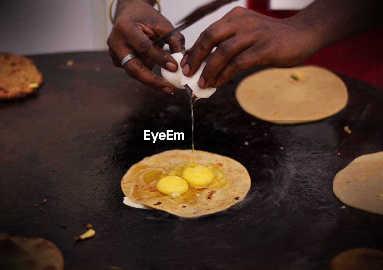 Close-up of man preparing food