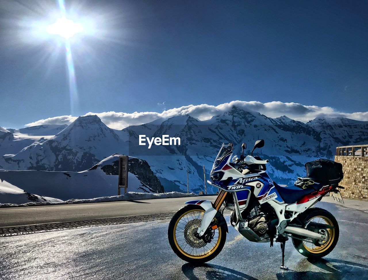 BICYCLES ON SNOWCAPPED MOUNTAINS AGAINST SKY