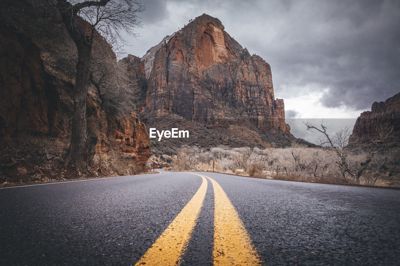 A road between mountains in zion national park, utah