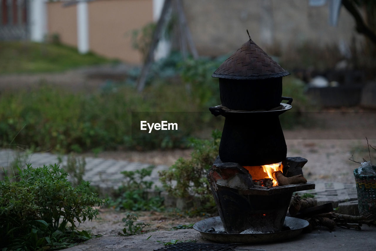 Old cooking pot stove using firewood as fuel.