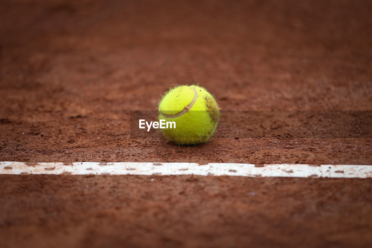 Close-up of tennis ball on field