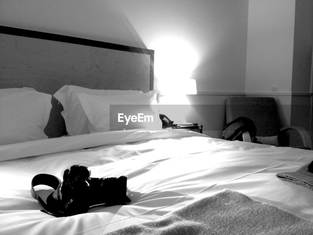 Camera on bed in hotel room