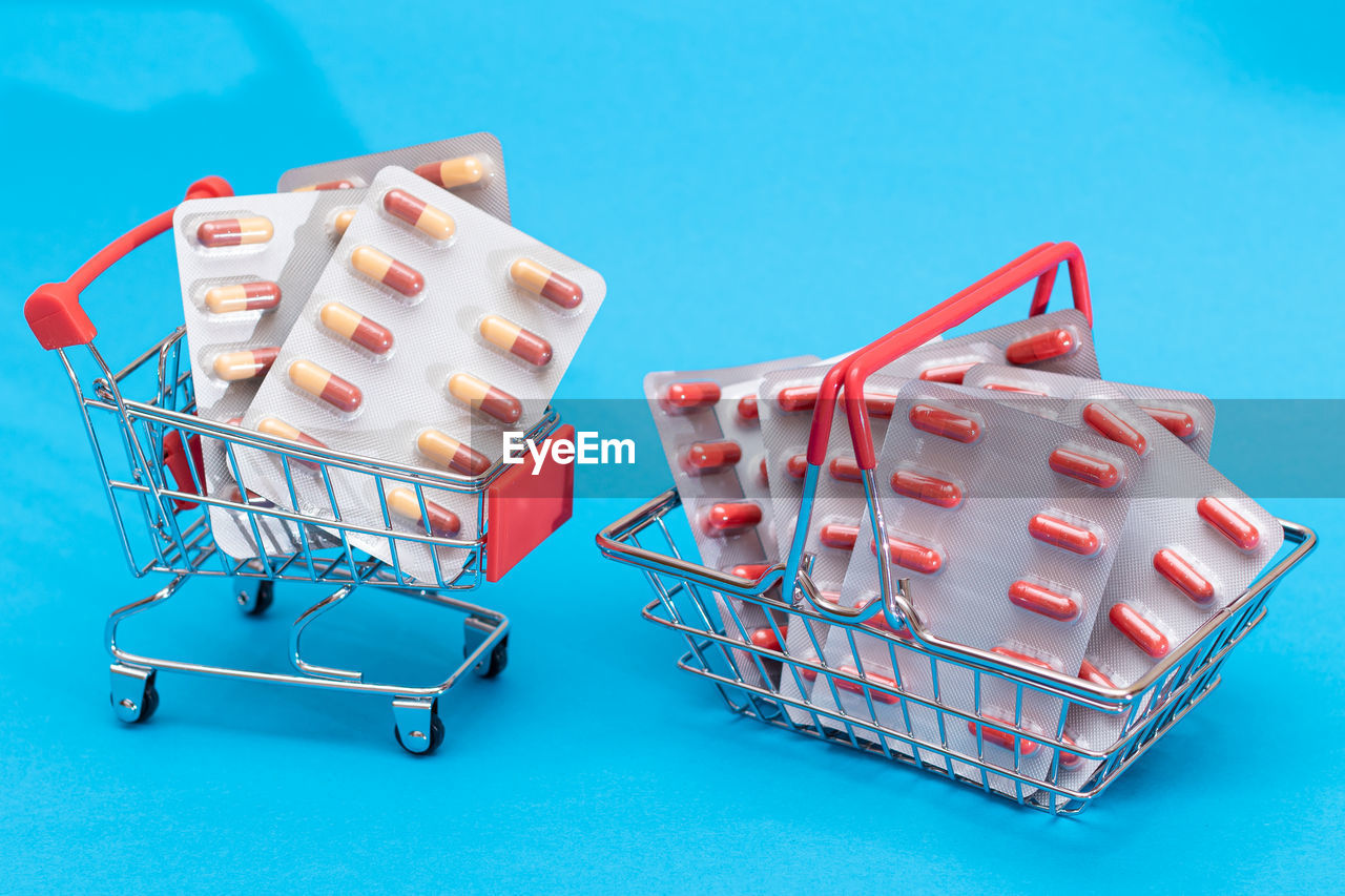 shopping cart, shopping, retail, consumerism, blue, blue background, cart, store, colored background, studio shot, no people, supermarket, food, indoors, buying, food and drink, vehicle, sale, finance
