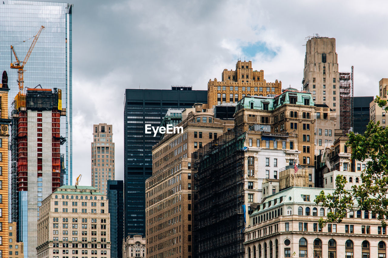 Buildings in city against sky